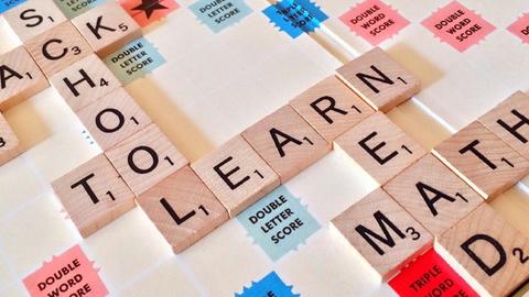 Scrabble tiles spelling out learn