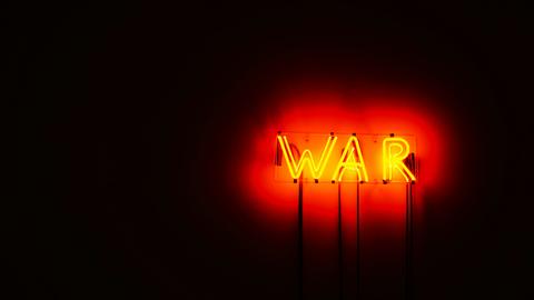 Neon sign that says WAR
