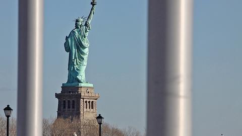 Statue of Liberty behind bars