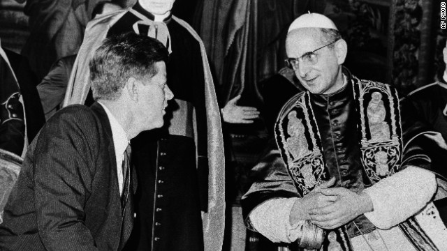 JFK speaking with priest