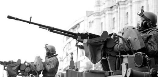 Adult man with gun in war battle black and white